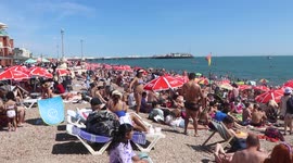 Thousands flock to Brighton beach amid record-breaking heatwave in the UK