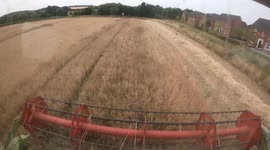 On board timelapse camera captures  drivers view from combine harvester in a Yorkshire field