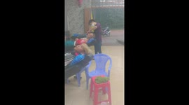 Vietnamese barber continues to work as floodwaters sweep through business