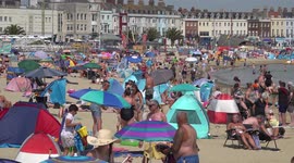 Brits swarm Weymouth beach as UK expected to have hottest ever day
