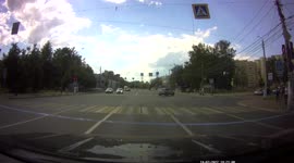 A car hit a man who was running a red traffic light