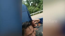 Lads cool off with paddling pool on the back of truck