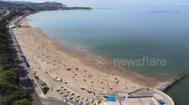 Wales' hottest day: Drone footage shows heat-seekers flocking to beach on north coast