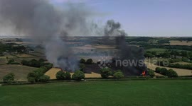 Firefighters tackle blazing countryside near Chesterfield, UK as temperatures in the area hit 35 degrees