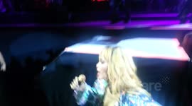 Rihanna hits fan with microphone
