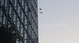 US dancers perform sky ballet on skyscraper windows in Shanghai