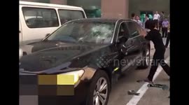 Wife angered by husband's alleged affair smashes £200,000 BMW with hammer