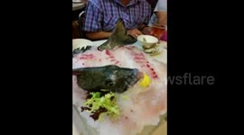 Fish, cut in half, moves on dinner plate
