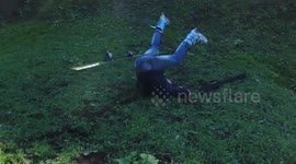 Man skis on dirt... crashes