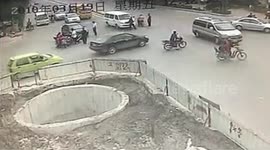 Motorcyclist crashes THREE times in succession then falls into well