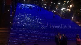Spiders crawl down stairs in cool light show at Kyoto station