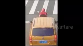 Delivery man gets hit by car and manages to land perfectly