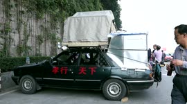 Man converts cheap car into cool camper