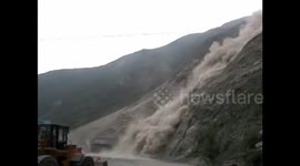 Moment of landslide blocking tunnel in China