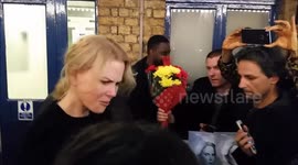 Actress Nicole Kidman gets flowers from a fan
