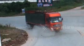 Scooter rider miraculously avoids getting crushed by truck