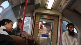 A London Man Trys To Cool Down By Sticking His Head Outside Tube Carriage Window On The Central Line