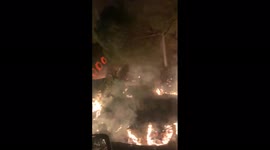 Motorist drives through hellish landscape as wildfire rages near road in Spain