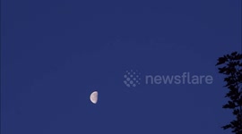 Waning Moon seen close to Jupiter in morning sky above Kent, UK