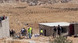 Palestinians argue with Israeli forces in  Yatta, south of Hebron, in the southern West Bank