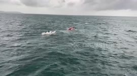 Fishermen rescued after floating in sea for nine hours when their boat capsized