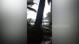 Panicked residents flees as tornado carries debris near their home