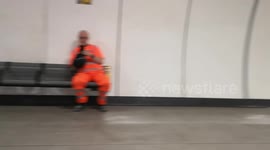 On Bank Underground Station two people find a cool place to practice rugby by using the new larger tunnels for the Northan Line platforms