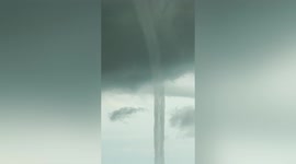 Snake-like waterspout appears near beachfront in the Philippines