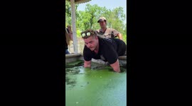 Snapping Turtle trying to bite a man's hand