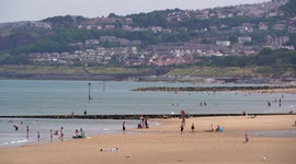 Hundreds flock to Welsh beach as UK records hottest ever day