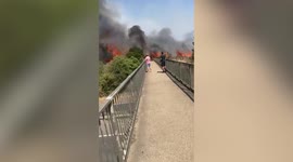 Shocking videos show a huge fire raging alongside the A2 motorway in Dartford, UK