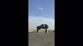 Crazy stunt guy jumping through an open car at a speed of 96 km per hour