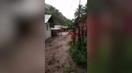 Residents flee as flash flood hits homes in the Philippines