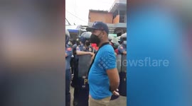 Vendors clash with riot police during demolition of market stalls in the Philippines