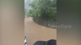 Heavy rain turns mountain road into raging muddy river in the Philippines