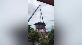 Residents move they entire house using crane