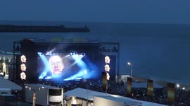 Thousands gather to watch Fatboy Slim's beach concert on 20th anniversary