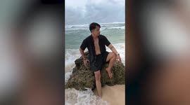 Tourist struck by massive waves while trying to take picture in photoshoot fail