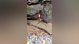 Villager sets water alight as gas emerges from river in southern China