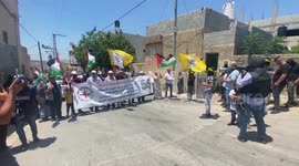 Palestinian protesters clash with Israeli security forces following a protest against the expropriation of Palestinian land