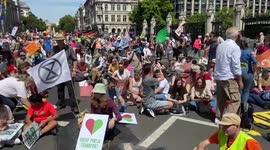Protesters block Parliament Square during a climate and cost of living march