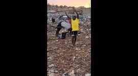 Children learn acrobatics in the midst of garbage in Katwe