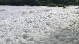Untreated chemicals cover Indian river with foam