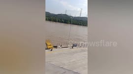 Chinese man drives boat to rescue woman that accidentally falls into river