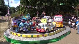 Children enjoy merry-go-round in Kensington Gardens in London