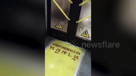 Flood pours through bus doors following heavy rain in Bangkok