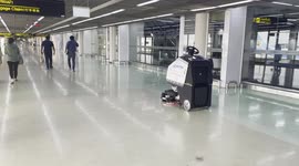 Robot cleaning machine drives itself around airport while polishing floor