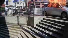 Terrified man flees as car explodes next to him in China