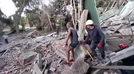 Ukraine emergency services clear rubble after airstrikes hit Kharkiv