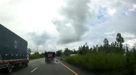 Pickup truck's rear wheel explodes sending it spinning out of control in Thailand